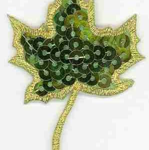 A Fall Leaf Sequin Green Maple Leaf Iron on Patch with gold and green leaves on a white background.