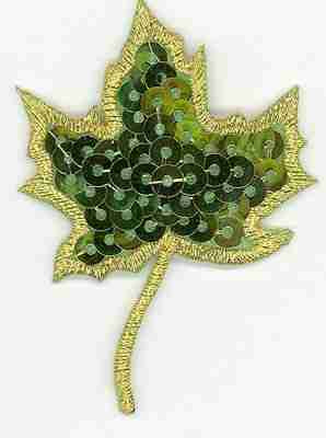 A Fall Leaf Sequin Green Maple Leaf Iron on Patch with gold and green leaves on a white background.