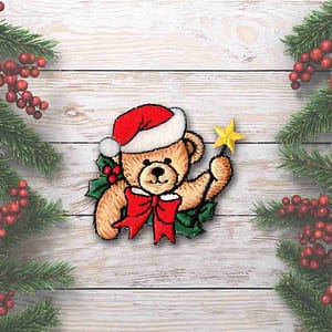 A Christmas Bear Patches (2-Pack) Christmas Embroidered Iron on Patch wearing a christmas hat and holding a star.