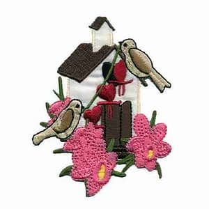 A Birdhouse with Birds and Pink Flowers Iron on Patch with birds and flowers embroidered on it.
