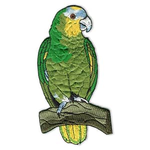 A green and yellow Jessica Galbreth Zodiac Cancer Sign Iron on Patch is sitting on a branch.