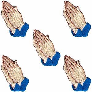 Four Praying Hands Iron On Religious Patches (5 Pack) embroidered on a blue shirt.