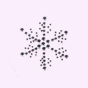 A Christmas Snowflake - Large Rhinestud Iron On Applique in SILVER made of black diamonds on a pink background.
