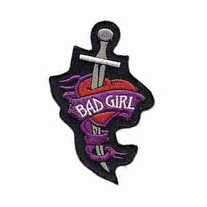 A Bad Girl Heart and Dagger Iron On Patch with the word bad girl on it.