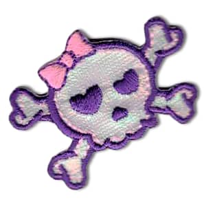 A purple and pink Pirate Skull with crossbones Iron on Patch with a bow on it.