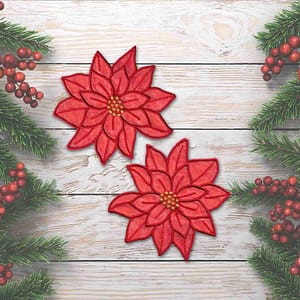 Two (2 Pack) Christmas Sparkly Layered Poinsettia Iron On Patch in Red on a wooden background.