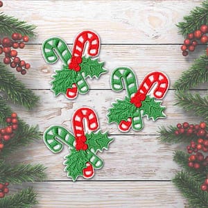 Three Candy Canes Patches (3-Pack) Christmas Embroidered Iron On Patch Applique on a wooden background.