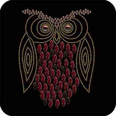 An Owl Nailhead Bird Iron On Rhinestone Applique with red beads on a black background.
