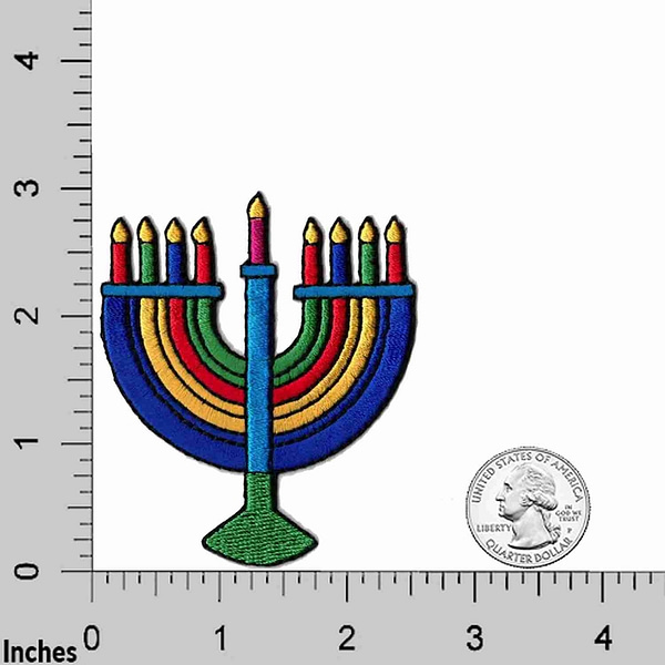 A Hanukkah - Menorah Candelabra Iron On Patch (2 Pack) applique on a ruler.