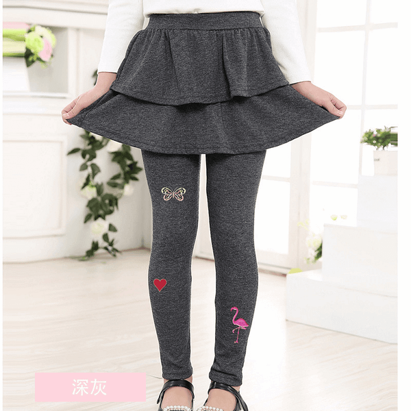 The girl is wearing a Pastel Butterfly Patches Cut Out (3-Pack) Embroidered Iron On Patch skirt and leggings.