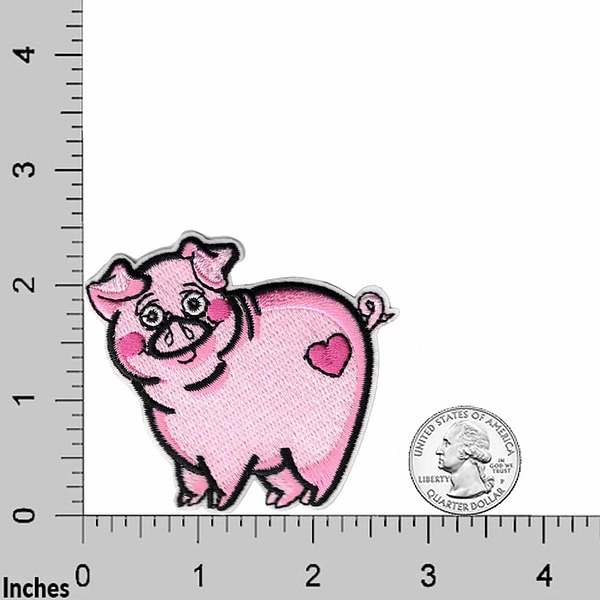 A Pig Patches (3-Pack) Animal Embroidered Iron On Patch Applique is standing next to a ruler.