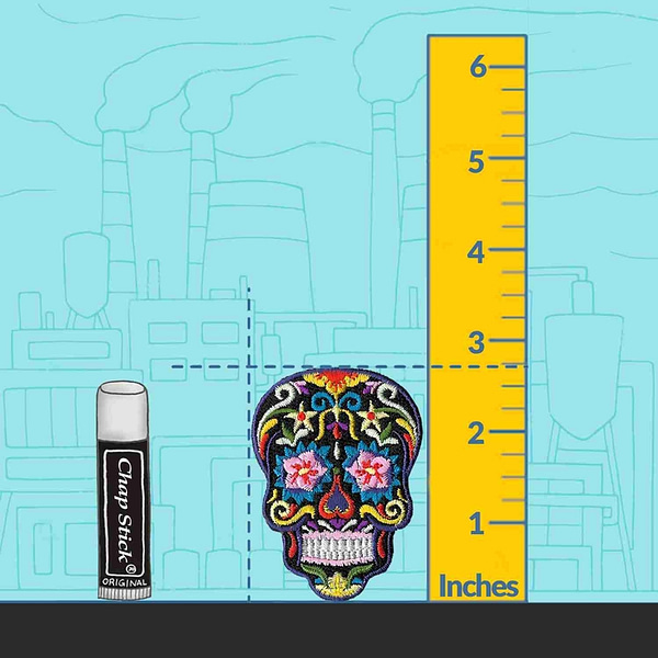 A Sugar Skull Colorful Iron on Patch with a ruler next to it.