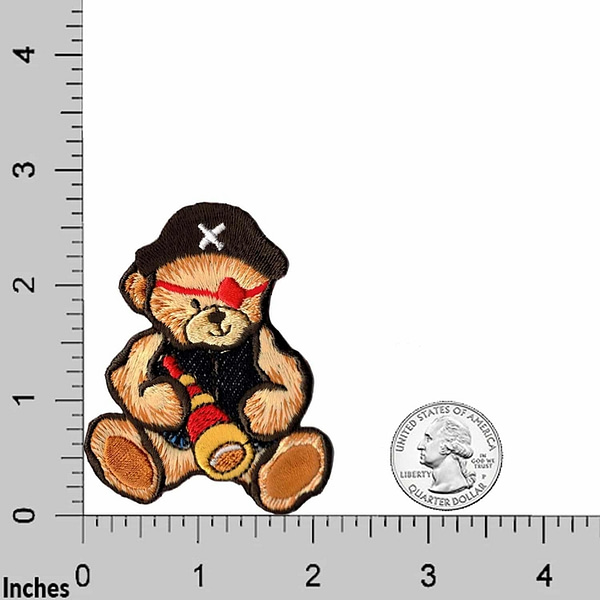 A Teddy Bear Patches (2-Pack) Children Embroidered Iron On Patch Applique with a pirate hat is shown next to a ruler.