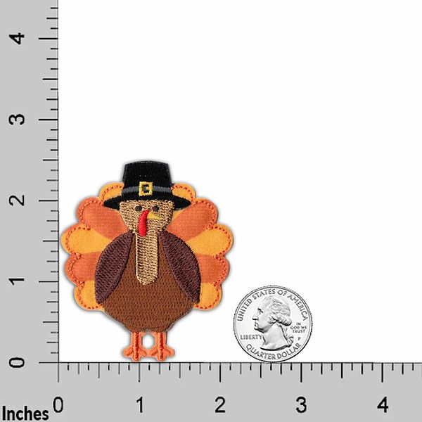 A Turkey Patches (2-Pack) Thanksgiving Embroidered Iron On Patch Appliques with a pilgrim hat next to a ruler.