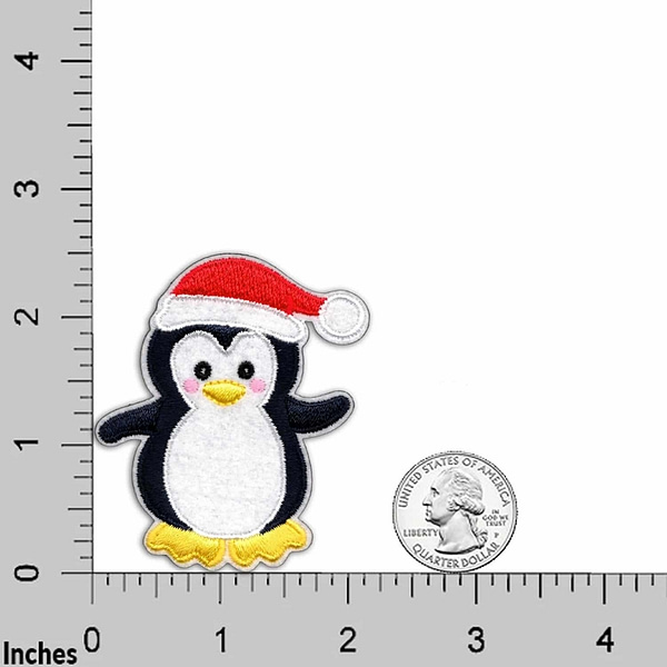 A Penguin Patches (2-Pack) Christmas Embroidered Iron On Patch Applique with a santa hat is next to a ruler.