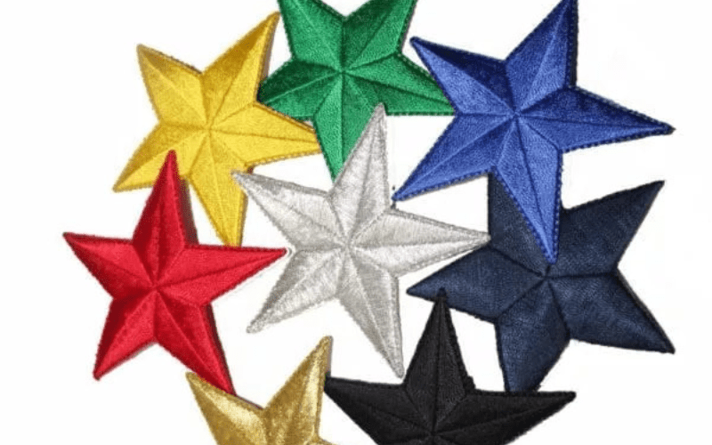 A group of star embroidered appliques in different colors.