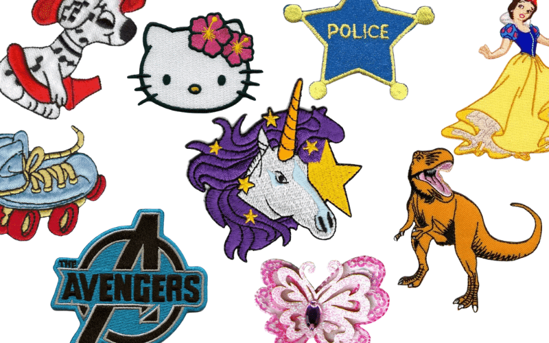 A variety of embroidered patches with various characters on them.